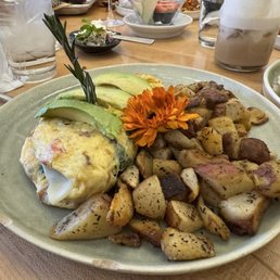 Avocado Tree Omelet with the fresh sprig of rosemary and flower garnish