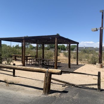 JD Campbell's - Hitching post and shaded seating bordering parking lot - Bars Near Me - Peoria, Arizona