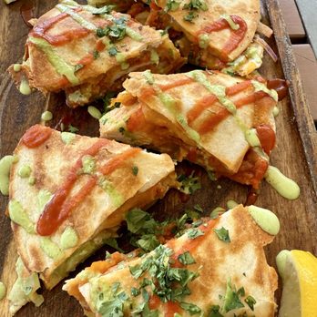 Next Door Beach Bistro - Chicken Quesadillas with Sriracha - Seafood Near Me - Flagler Beach, Florida Next Door Beach Bistro - Chicken Quesadillas with Sriracha - Seafood Near Me - Flagler Beach, Florida