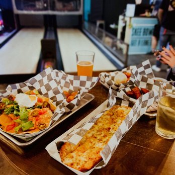 Circuit Social - two trays of food on a table - Arcades Near Me - Norfolk, Virginia Circuit Social - two trays of food on a table - Arcades Near Me - Norfolk, Virginia