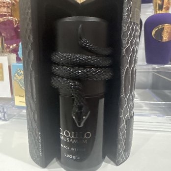 Macy's - The box hugging the perfume. A black snake is wrapped around the bottle. - Department Stores Near Me - Los Angeles, California Macy's - The box hugging the perfume. A black snake is wrapped around the bottle. - Department Stores Near Me - Los Angeles, California