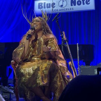 Blue Note Jazz Clubs - View of Lizzo sitting down from one of the front/center tables, next to the aisle not the stage - Music Venues Near Me - Los Angeles, California
