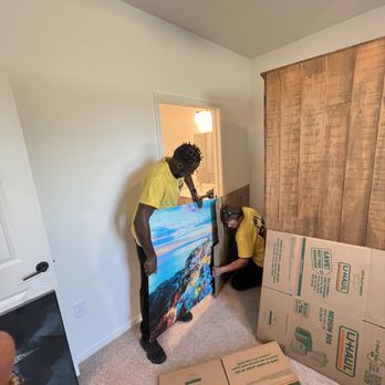 B F Happy Movers - Putting pictures in box for extra protection - Movers Near Me - Pensacola, Florida B F Happy Movers - Putting pictures in box for extra protection - Movers Near Me - Pensacola, Florida