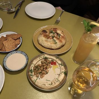 Shukette - Frena (the best!!) w hummus and gluten-free cracker. Orange wine and spritz. - Middle Eastern Near Me - New York, New York Shukette - Frena (the best!!) w hummus and gluten-free cracker. Orange wine and spritz. - Middle Eastern Near Me - New York, New York