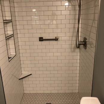 Holtzman Remodeling - a white tiled shower - General Contractors Near Me - Tempe, Arizona