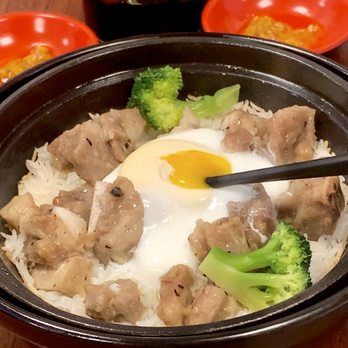 The Rice House - Breaking the egg in my Pork Ribs with Black Bean Sauce Claypot Rice - Cantonese Near Me - Milpitas, California The Rice House - Breaking the egg in my Pork Ribs with Black Bean Sauce Claypot Rice - Cantonese Near Me - Milpitas, California