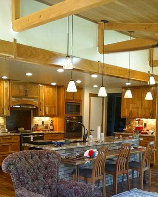 Kitchen Remodel with Sunroom Addition - This remodel/addition included custom rustic cherry cabinets, granite countertops, patina finished metalwork, timber framing, and custom made trim. Erik and Melissa worked with the customers carefully to design their dream addition, and now they say it's the room they spend the most time in.