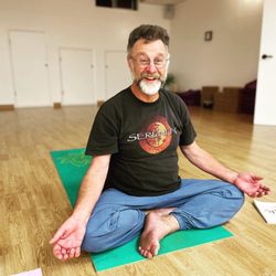 Gentle Yoga & Breath and Meditation teacher Jamie in sukhasana, easy seat!