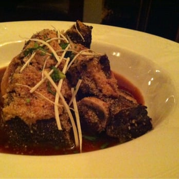 Petit Louis Bistro - Breaded short ribs over mashed potatoes au jus - French Near Me - Baltimore, Maryland