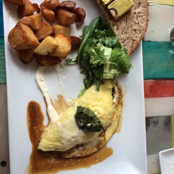 Bottle + Kitchen - Breakfast - steak and eggs omelette with herb salsa, potatoes, salad and wheat toast. - American Near Me - Portland, Oregon Bottle + Kitchen - Breakfast - steak and eggs omelette with herb salsa, potatoes, salad and wheat toast. - American Near Me - Portland, Oregon