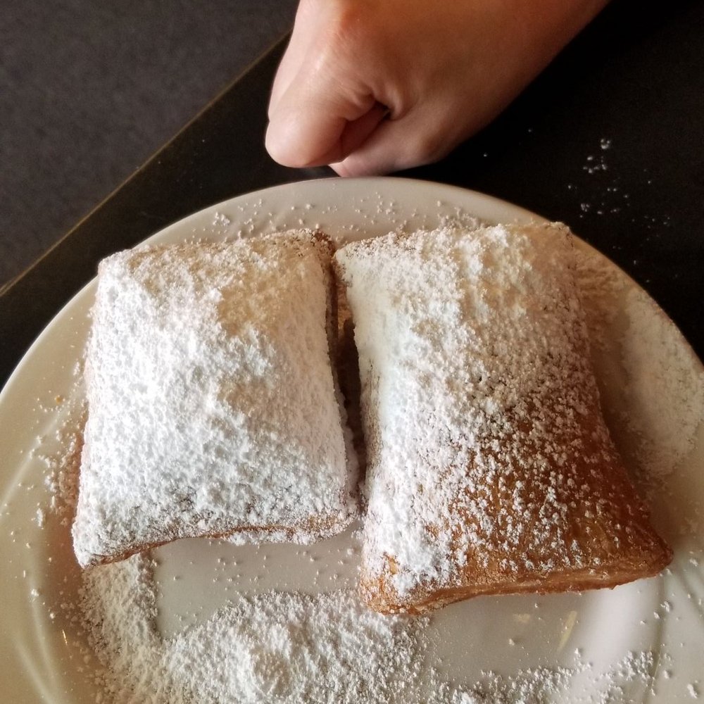 Lucile's Creole Cafe - Beignets next to my girlfriends fist - Cajun/Creole Near Me - Denver, Colorado