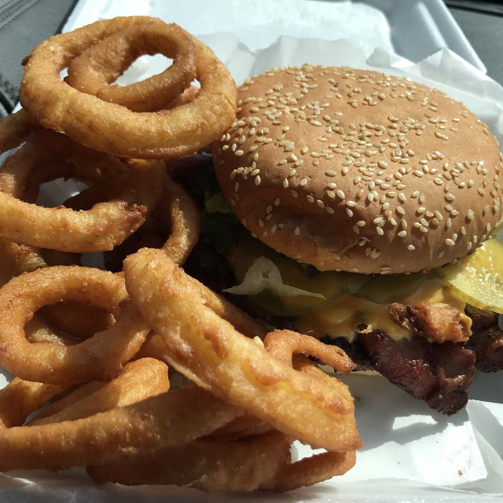 a hamburger and onion rings a hamburger and onion rings