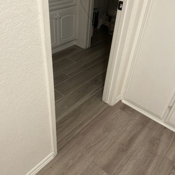 JD'S Quality Construction & Maintenance - Hallway and restroom, seemless transition from flooring to tile! - General Contractors Near Me - Hesperia, California JD'S Quality Construction & Maintenance - Hallway and restroom, seemless transition from flooring to tile! - General Contractors Near Me - Hesperia, California