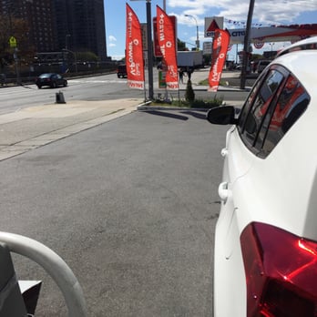 Shell - a white car parked at a gas station - Gas Stations Near Me - Bronx, New York