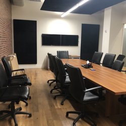 T-N-T Electronics - Acoustic cloud & wall installation with video conferencing