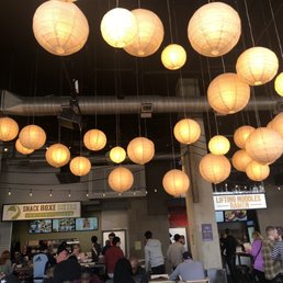 a large group of people eating in a restaurant