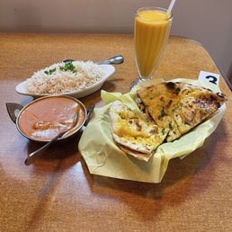 Butter chicken, garlic naan, mango lassi and rice. Butter chicken, garlic naan, mango lassi and rice.