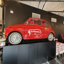 Pummarola - Fort Lauderdale - Half of a vintage fiat mounted on the wall