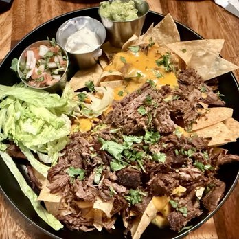 Nosh Bar - Nachos with shredded beef, very delicious! - Pizza Near Me - Costa Mesa, California Nosh Bar - Nachos with shredded beef, very delicious! - Pizza Near Me - Costa Mesa, California