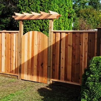Coast Redwood Landscaping - New cedar fence with arbor above the gate - Tree Services Near Me - Aldergrove, British Columbia Coast Redwood Landscaping - New cedar fence with arbor above the gate - Tree Services Near Me - Aldergrove, British Columbia