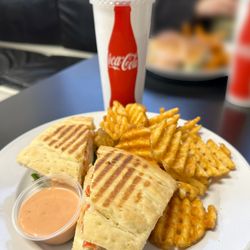 Avenue Bakery - Tuscan Chicken panini with waffle fries and a drink.