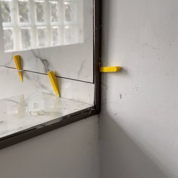 Fodor & Sons Construction - Uneven siding and poor tile work - Handyman Near Me