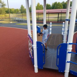 Twin Creeks Park - Ian pretending to operate a rocket ship.