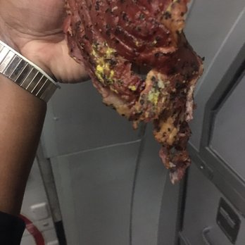Jason's Deli - a hand holding a piece of pizza - Salad Near Me - Raleigh, North Carolina Jason's Deli - a hand holding a piece of pizza - Salad Near Me - Raleigh, North Carolina