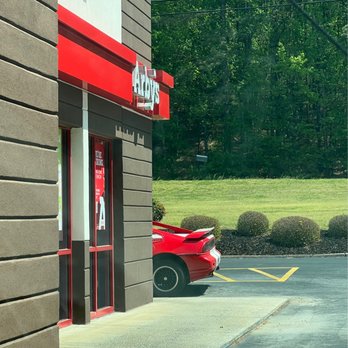 McDonald's - a red sports car parked in front of a restaurant - Fast Food Near Me - Cartersville, Georgia