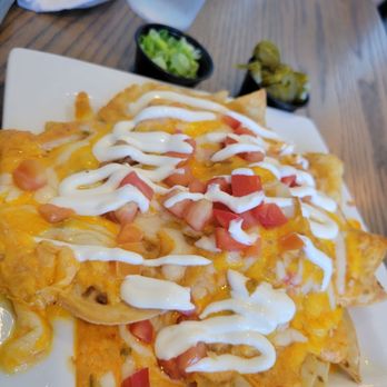South Beach Grill - Seafood Nachos for two , green onions and jalapeños on the side. - Seafood Near Me - Wrightsville Beach, North Carolina South Beach Grill - Seafood Nachos for two , green onions and jalapeños on the side. - Seafood Near Me - Wrightsville Beach, North Carolina