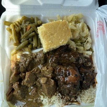 Little Jamaican Restaurant - Combo plate: curry goat, jerk chicken over white rice, cabbage, green beans, and corn bread - Caribbean Near Me - Albany, Georgia Little Jamaican Restaurant - Combo plate: curry goat, jerk chicken over white rice, cabbage, green beans, and corn bread - Caribbean Near Me - Albany, Georgia
