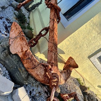 The Anchor - an anchor on a rock in front of a building - Seafood Near Me - Flagler Beach, Florida