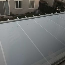 View from second floor of house of the roof of patio.