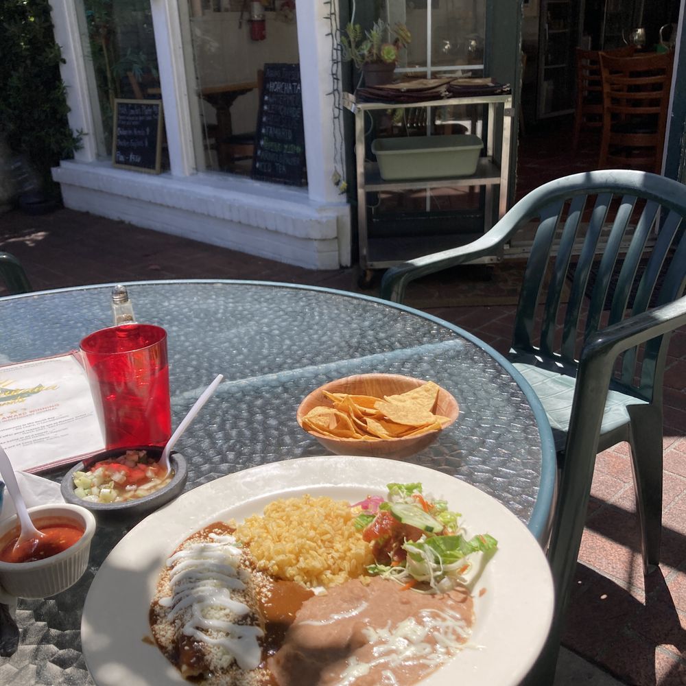Casa Manana Restaurant - Cheese enchilada, rice, refried beans and salad topped with their famous chocolate mole!  Heavenly. - Mexican Near Me - San Rafael, California