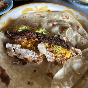 Lupe Tortilla Mexican Restaurant - Filling huge tortilla with fajitas and charro beans - Tex-Mex Near Me - Shenandoah, Texas