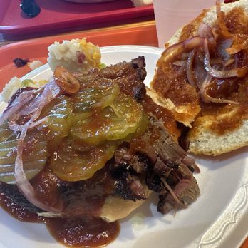 Chappell Hill Bakery & Deli - Sliced brisket sandwich with extra sauce - Bakeries Near Me - Chappell Hill, Texas