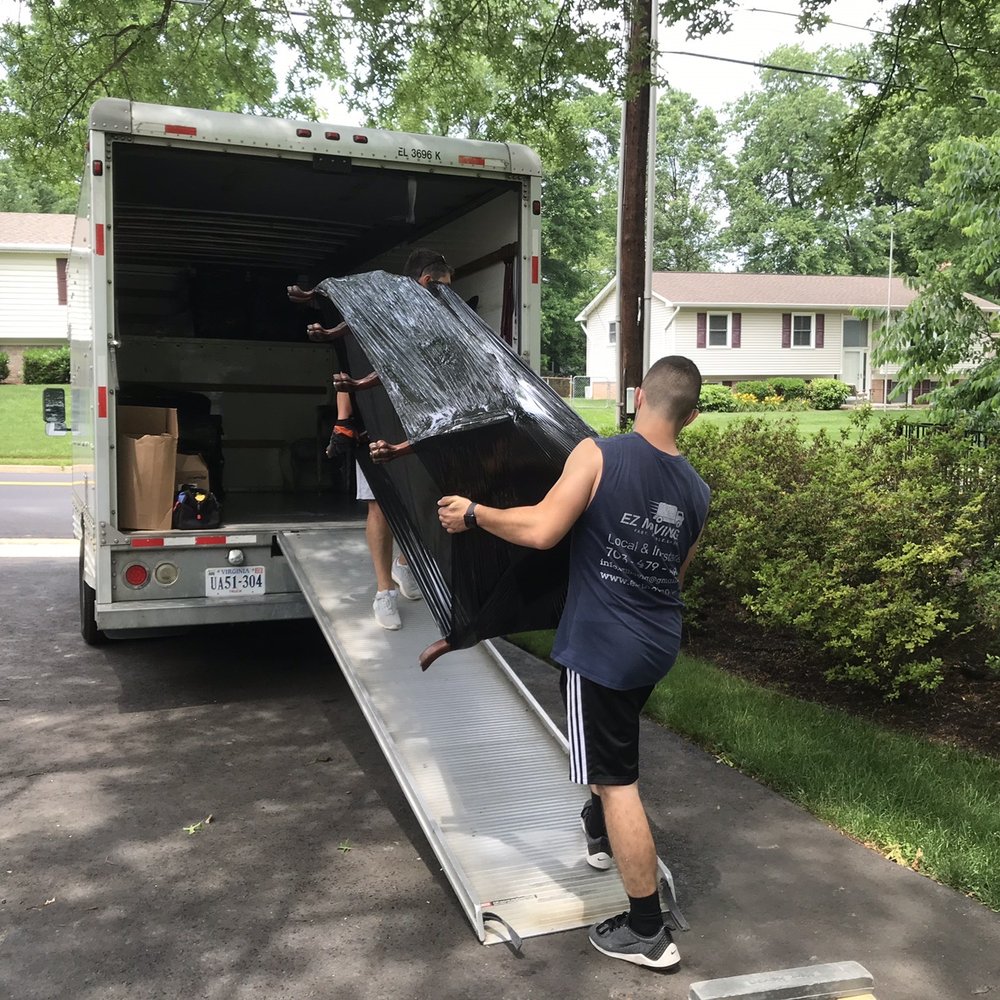 Ez Moving & Storage - Petro and his crew easily handling a heavy couch with ease. - Movers Near Me - McLean, Virginia