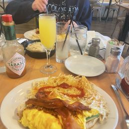 The little lion, 2 eggs, 2 strips of bacon, avocado, chili paste and drizzled with hot honey served over a sourdough toast. The little lion, 2 eggs, 2 strips of bacon, avocado, chili paste and drizzled with hot honey served over a sourdough toast.