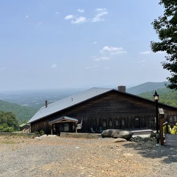 Stone Mountain Vineyards - a wooden building with a view of the valley below - Wineries Near Me - Dyke, Virginia