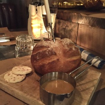 Cleaver - Baked bread with bacon butter and chicken drippings - Modern European Near Me - Calgary, Alberta Cleaver - Baked bread with bacon butter and chicken drippings - Modern European Near Me - Calgary, Alberta