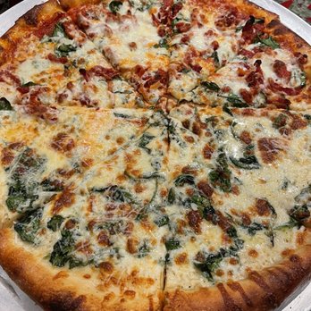 Wall ST Pizza - Half Sun dried tomatoes/arugula/spinach and half white pizza - Pizza Near Me - Culver City, California