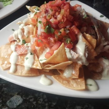 Dirty Oscar's Annex - Simple Nachos at HH with smoked cheddar sauce, green chili crema and added pan-seared chicken - very tasty - Pubs Near Me - Tacoma, Washington Dirty Oscar's Annex - Simple Nachos at HH with smoked cheddar sauce, green chili crema and added pan-seared chicken - very tasty - Pubs Near Me - Tacoma, Washington
