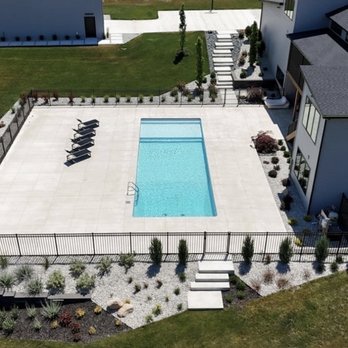 Sharks Pools - Get a stunning aerial view of the swimming pool project from above, revealing its beauty from a side perspective. - Pool & Hot Tub Service Near Me Sharks Pools - Get a stunning aerial view of the swimming pool project from above, revealing its beauty from a side perspective. - Pool & Hot Tub Service Near Me