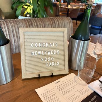 Earls Kitchen + Bar - sign of newleywed congrats and chilled wine bottles - Cocktail Bars Near Me - Honolulu, Hawaii Earls Kitchen + Bar - sign of newleywed congrats and chilled wine bottles - Cocktail Bars Near Me - Honolulu, Hawaii