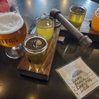 Lat 65 Brewing - Nanooks on the left, then flight with drinks listed in picture (first 3 ciders) - Breweries Near Me - Fairbanks, Alaska