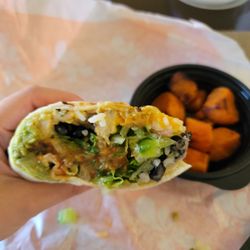 Baja chicken wrap with the sweet potatoes in the background.