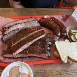 Fatty brisket, pork ribs, jalapeño cheese, house 707 sausage and banana pudding.  Includes white bread and side of pickles.