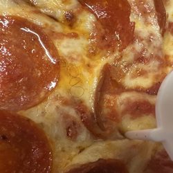 Jet's Pizza - Pepperoni pizza with a curly black hair in it
