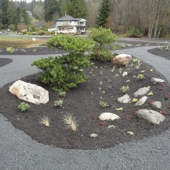 Moore's Works - a garden with rocks and shrubs - Landscaping Near Me - Indianola, Washington Moore's Works - a garden with rocks and shrubs - Landscaping Near Me - Indianola, Washington