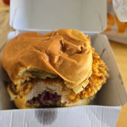 Chicken Bun Bun - One bite taken out of this huge spicy chicken sandwich!